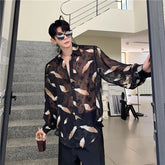 Threebooy Men Sexy Feather Hollowed Out Shirt Men's Lapel Long Sleeved Transparent Clothing Streetwear Casual Loose Trendy Design Tops