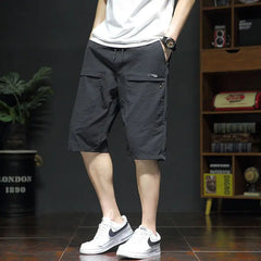 Threebooy Summer New Fashion Casual Versatile Loose Beach Shorts Men Elastic Waist Drawstring Pockets Big Size Sports Straight Short Pants
