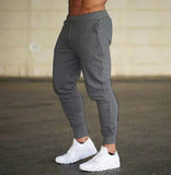 Threebooy New Fashion Men Gyms Solid Pants Joggers Fitness Casual Long Pants Men Workout Skinny Sweatpants Jogger Tracksuit Trousers