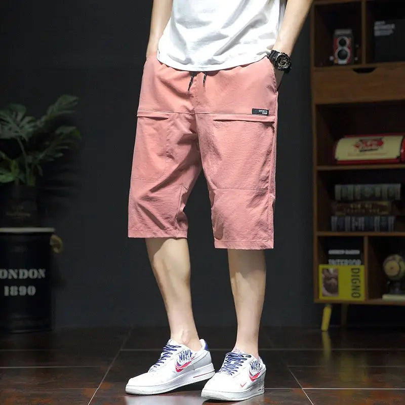 Threebooy  Summer New Fashion Casual Versatile Loose Beach Shorts Men Elastic Waist Drawstring Pockets Big Size Sports Straight Short Pants