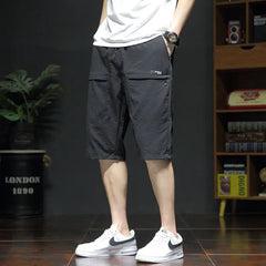 Threebooy  Summer New Fashion Casual Versatile Loose Beach Shorts Men Elastic Waist Drawstring Pockets Big Size Sports Straight Short Pants