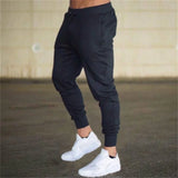 Threebooy New Fashion Men Gyms Solid Pants Joggers Fitness Casual Long Pants Men Workout Skinny Sweatpants Jogger Tracksuit Trousers