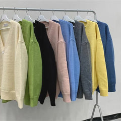 Threebooy Youthful and Trendy Men Spring and Autumn New Spliced V-neck Button Fashion Solid Color Loose Casual Long-sleeved Knitted Top