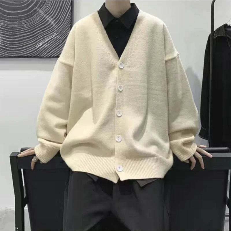 Threebooy Youthful and Trendy Men Spring and Autumn New Spliced V-neck Button Fashion Solid Color Loose Casual Long-sleeved Knitted Top